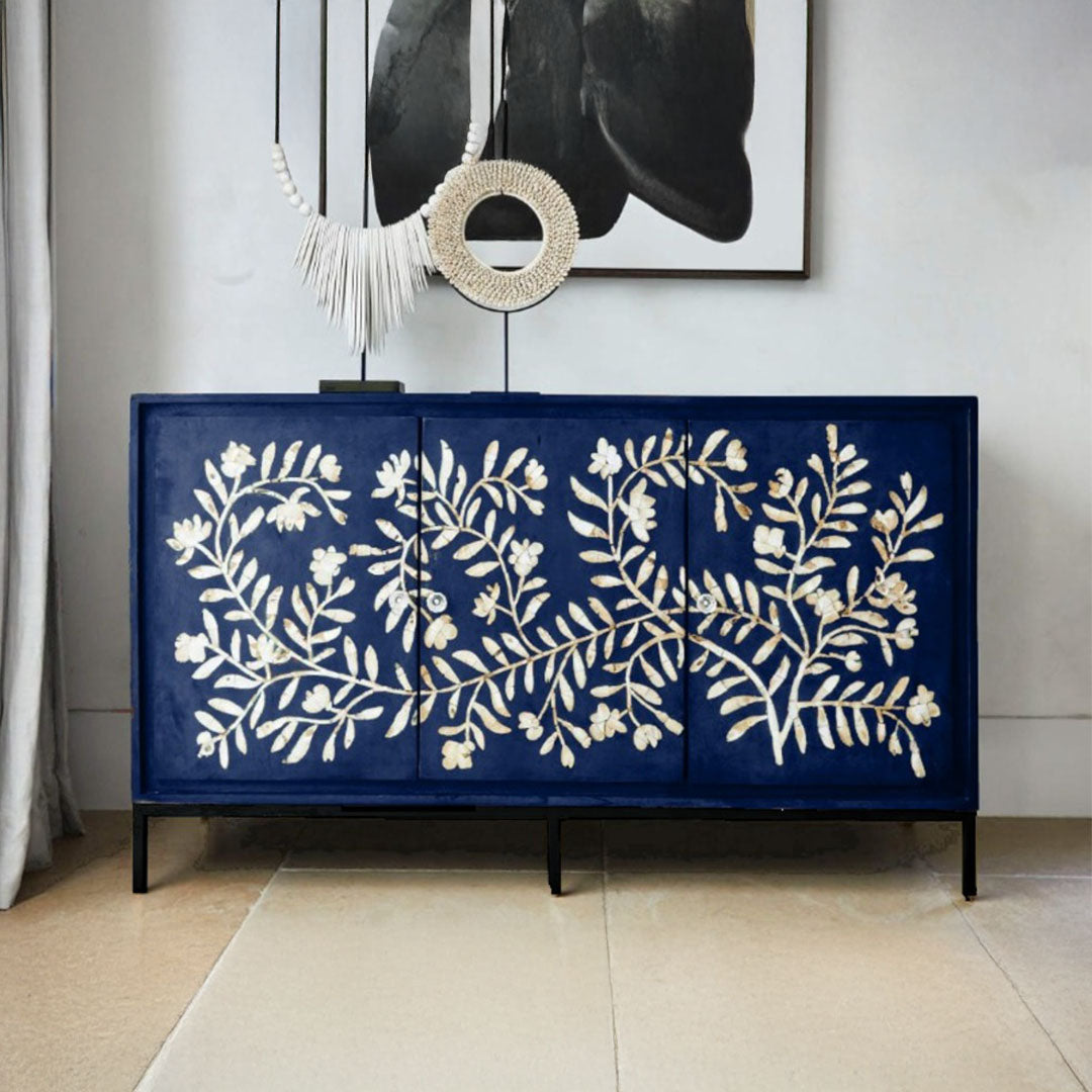 Handcrafted blue cabinet with intricate mother-of-pearl inlay, featuring a floral pattern and sleek metal legs. A luxurious storage solution for any space.