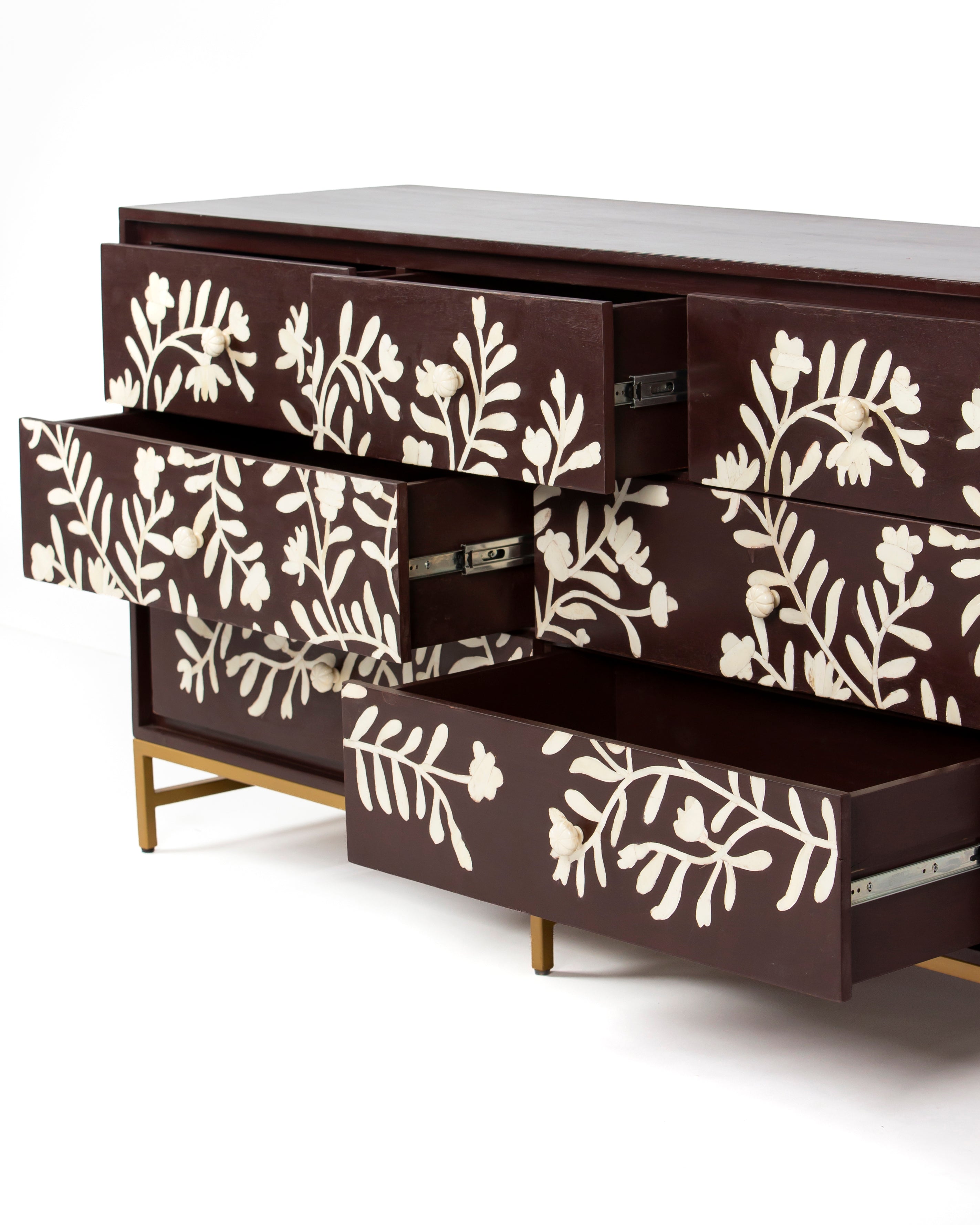 Luna chest of drawers with three drawers open showing burgundy interiors