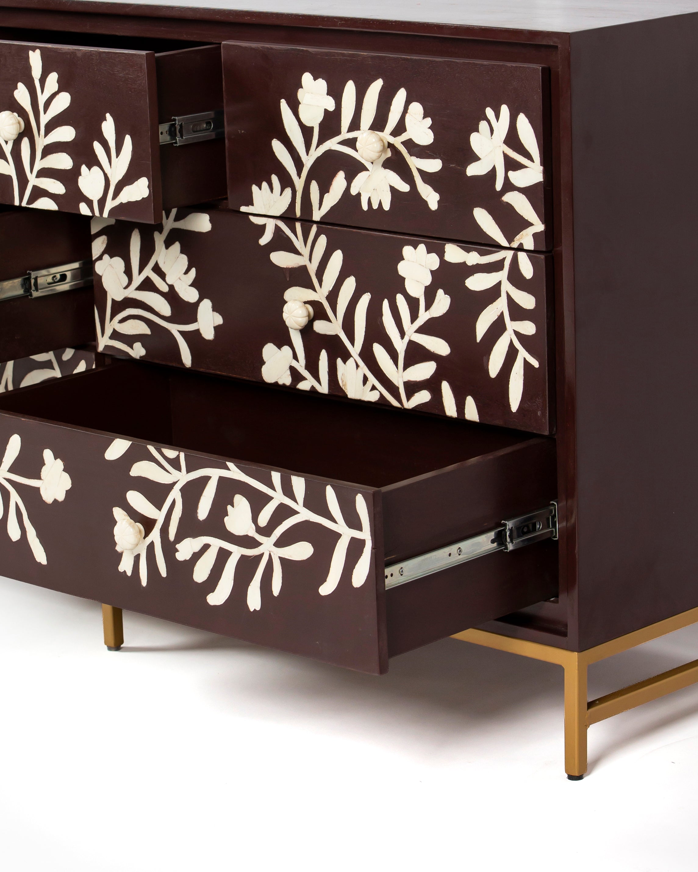 Angled view of Luna burgundy dresser with drawers open