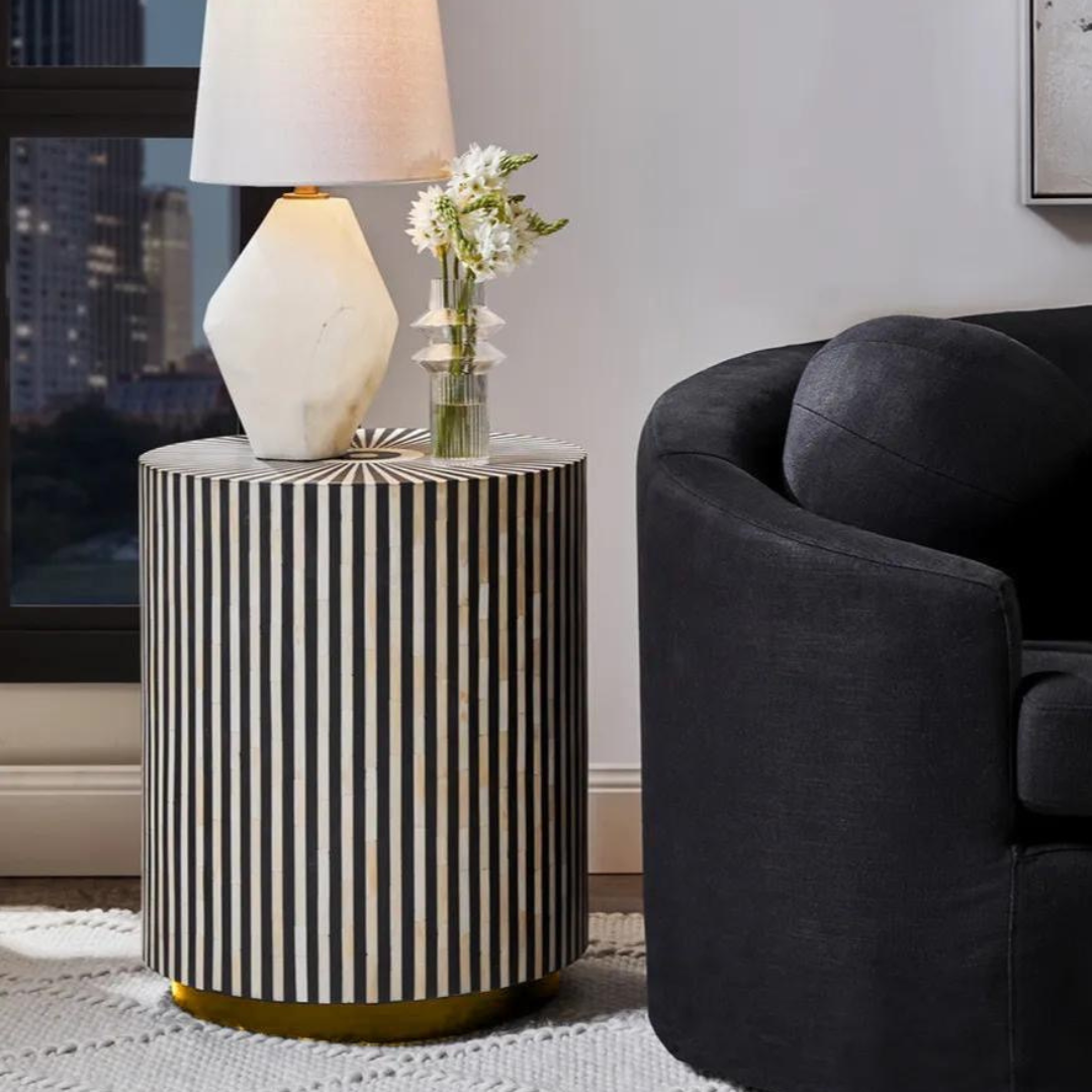 Black bone inlay side table with a striking striped pattern and round.