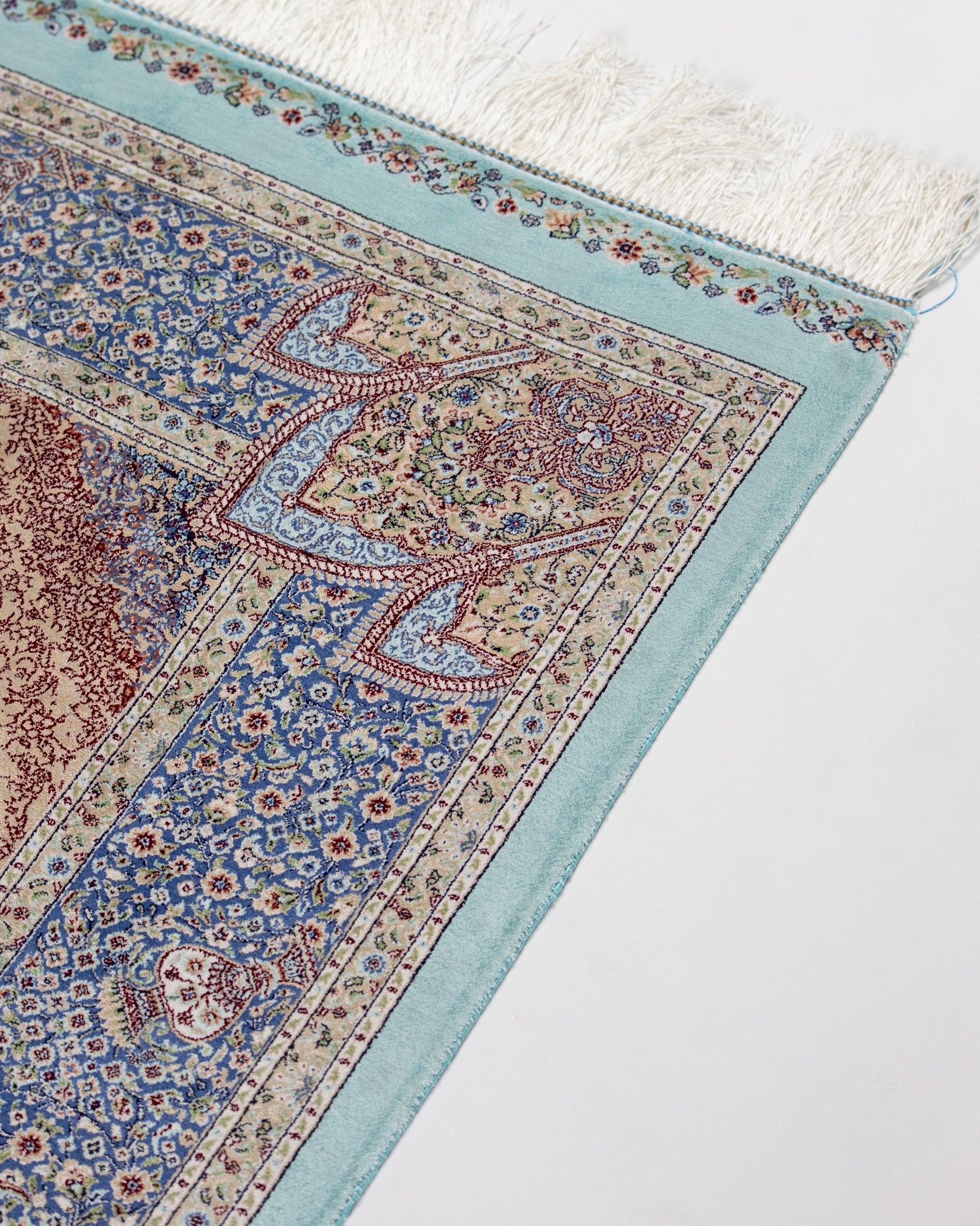 reverse showing the fine silk weave on the Nasrin blue silk rug