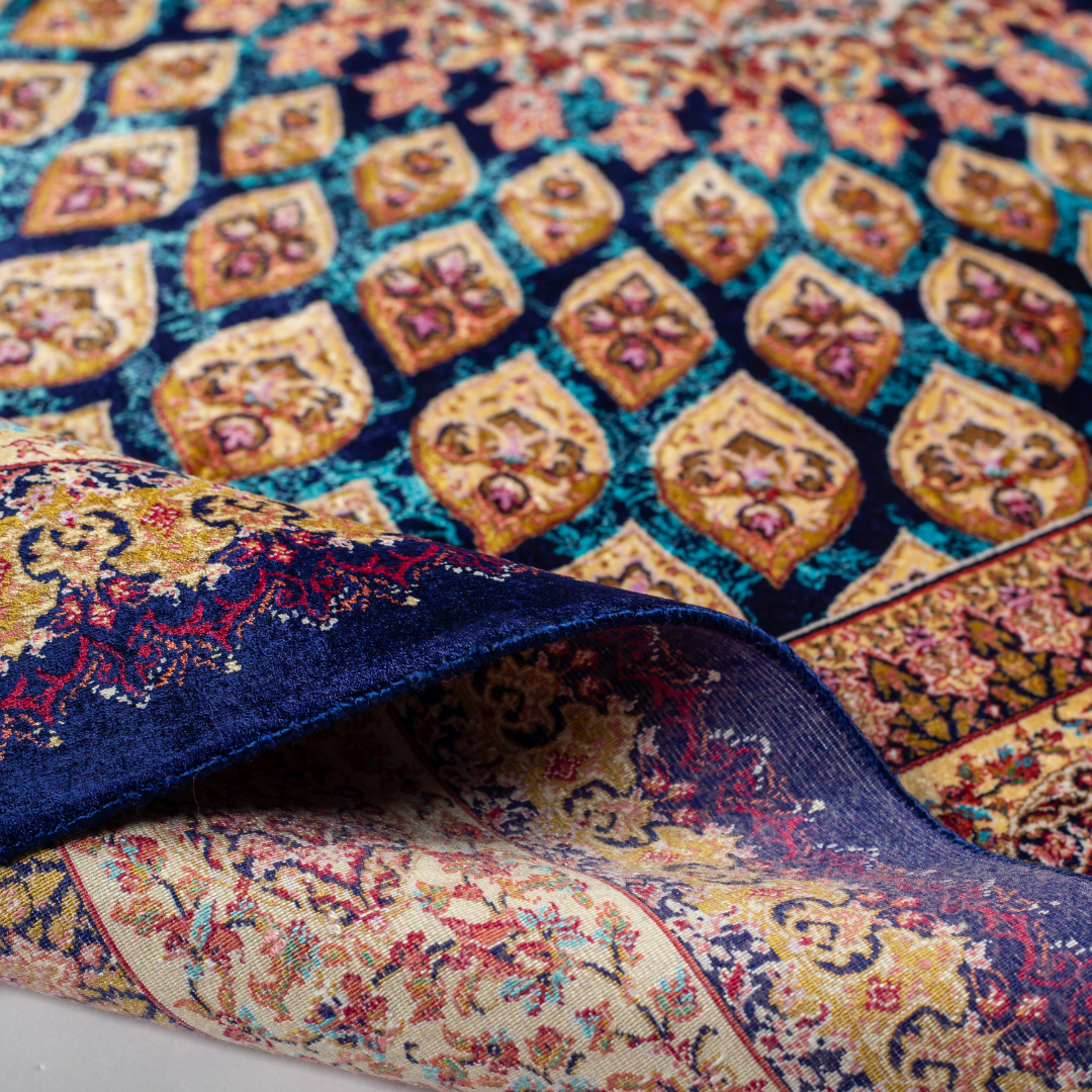 Navira silk rug featuring a medallion and floral design in navy, ruby, teal, and ivory. Size: 150x100 cms.