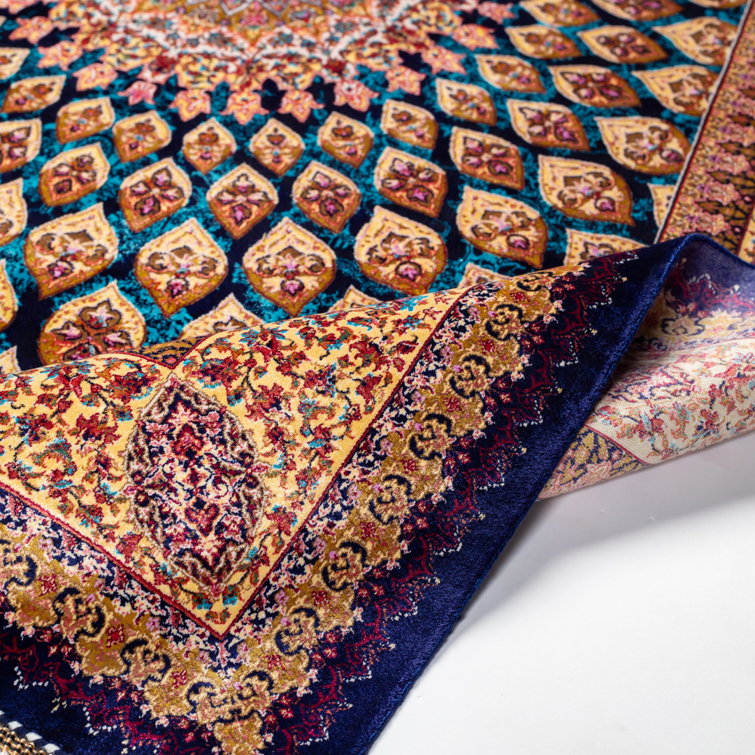 Navira silk rug featuring a medallion and floral design in navy, ruby, teal, and ivory. Size: 150x100 cms.