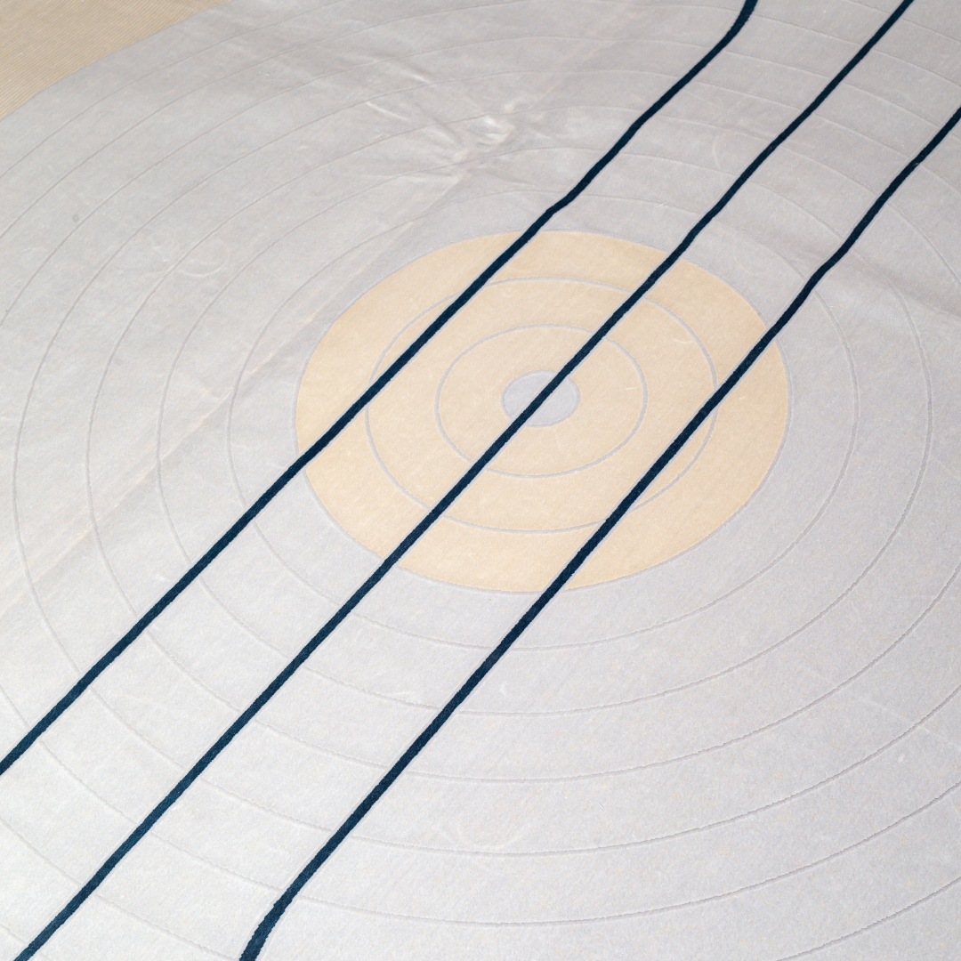 Orrin cotton Rug in 200x300 cm featuring beige and ivory tones with minimal blue line and circle design, made from soft silk blend.
