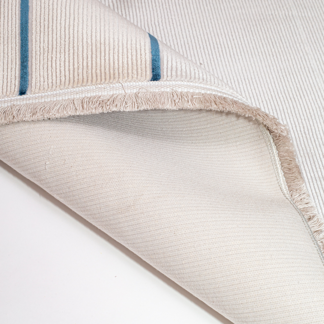 Orrin cotton Rug in 200x300 cm featuring beige and ivory tones with minimal blue line and circle design, made from soft silk blend.