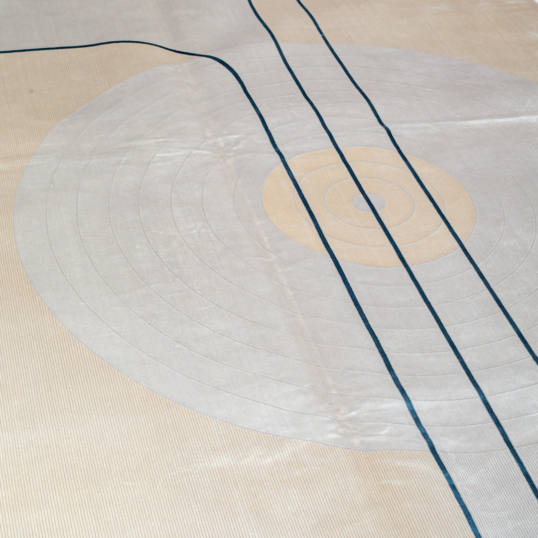 Orrin cotton Rug in 200x300 cm featuring beige and ivory tones with minimal blue line and circle design, made from soft silk blend.
