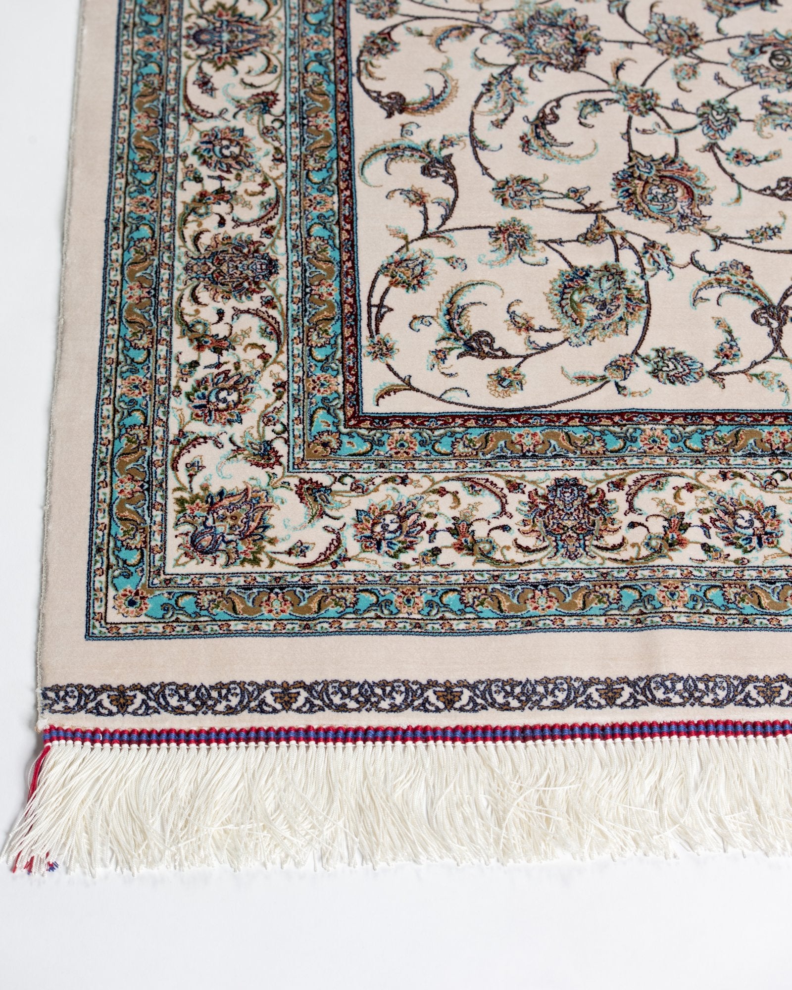 border and field detail on the Parisa ivory silk rug