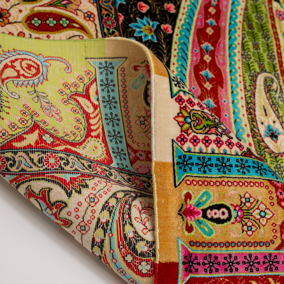 Ravana Silk Rug in 200x300 cms featuring intricate multicolour motifs with a bold medallion, paisleys, and vibrant borders.