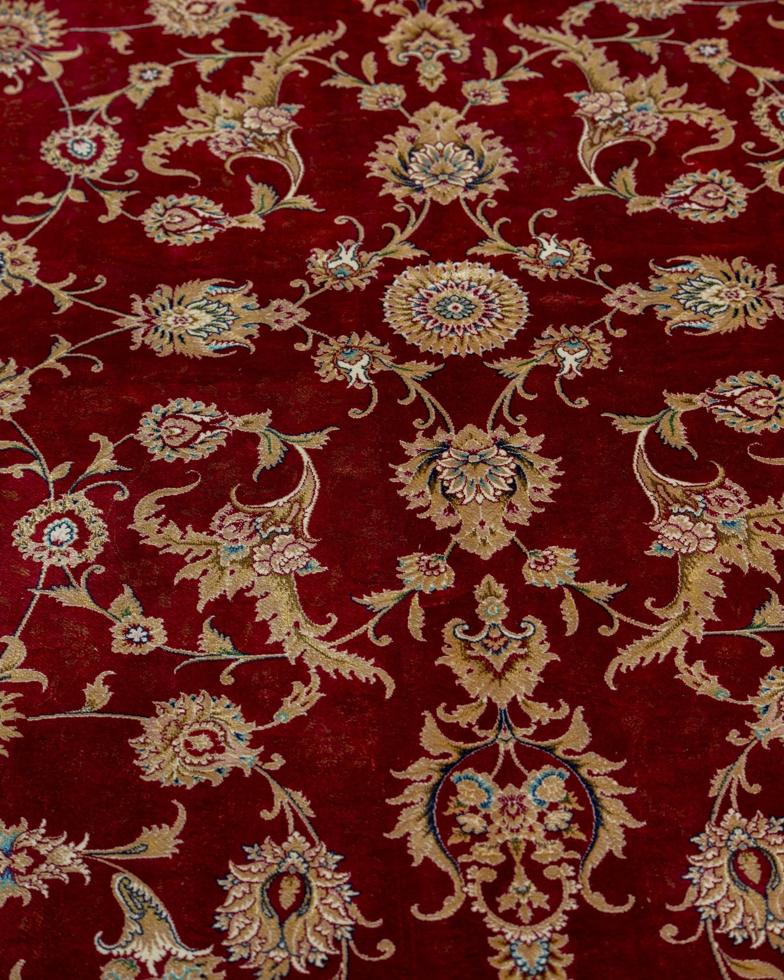 Ravenna silk carpet angled view showing crimson red tones, 200 x 300 cm - Tabeer Homes Dubai