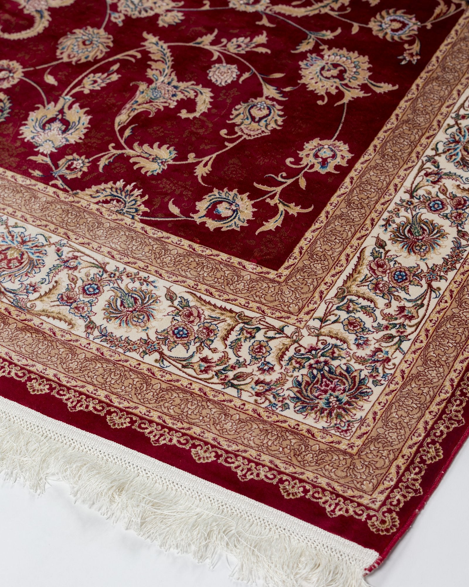 Ravenna Persian silk rug folded corner showing fine weave, crimson red 200 x 300 cm - Tabeer Homes Dubai