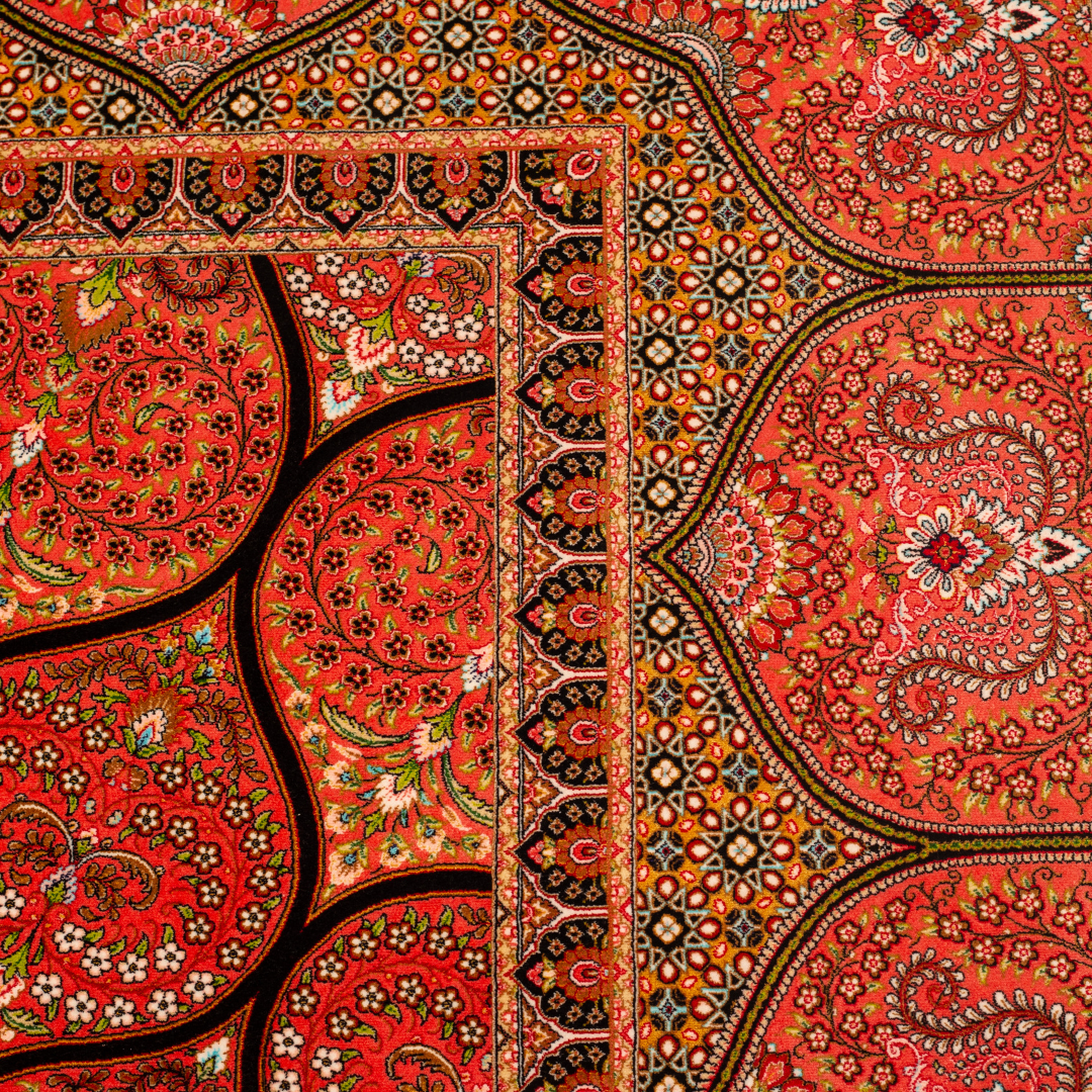 Detailed view of the Sarveen silk rug in 200x300 cms featuring a red medallion pattern with floral motifs and intricate border work.