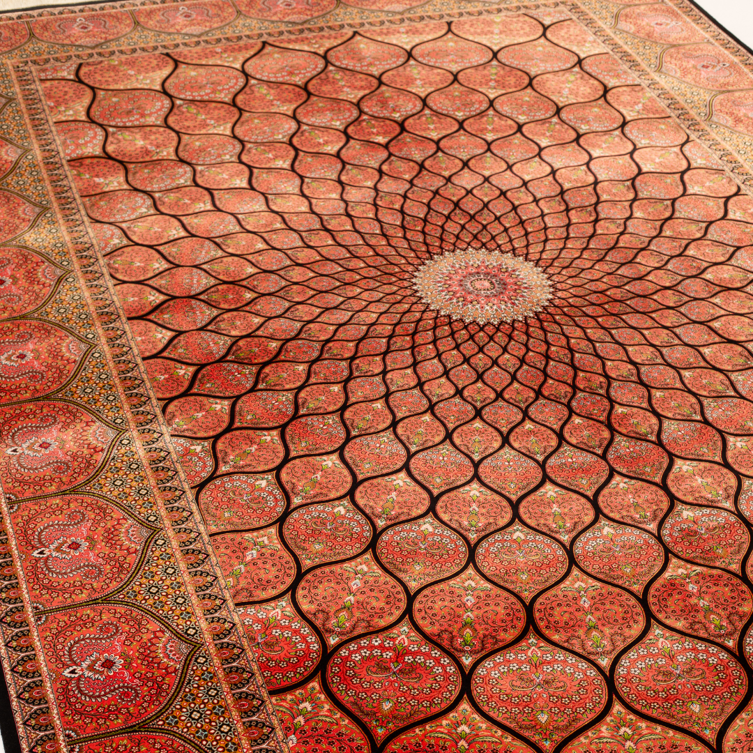 Detailed view of the Sarveen silk rug in 200x300 cms featuring a red medallion pattern with floral motifs and intricate border work.