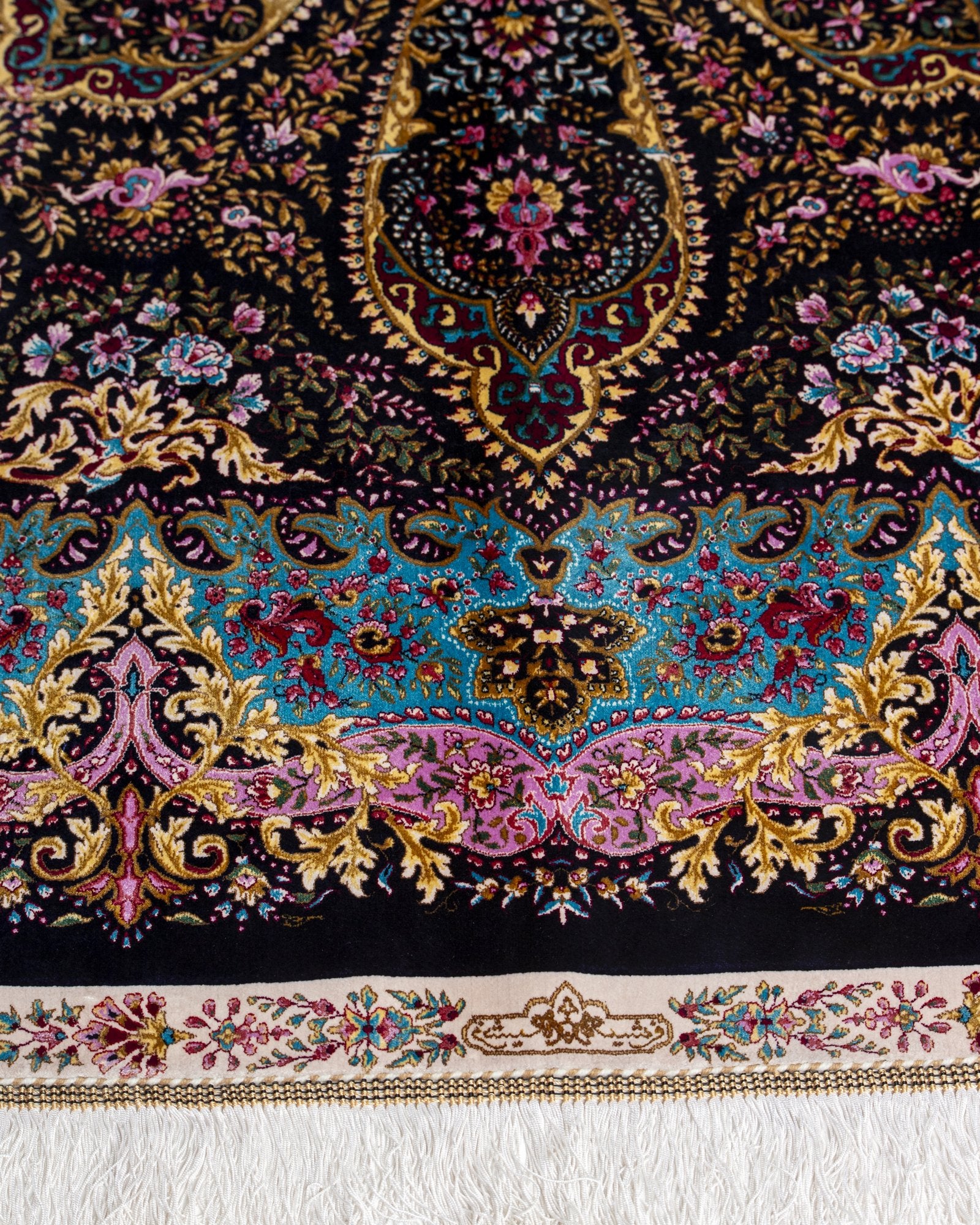border pattern detail on the Selene charcoal silk rug