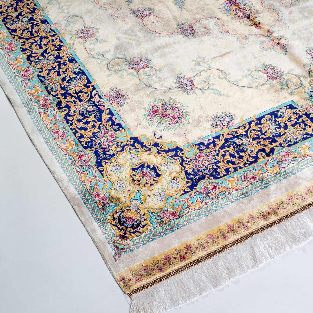 Close-up of the Seraphine silk rug showing intricate floral patterns, soft sheen and detailed design.
