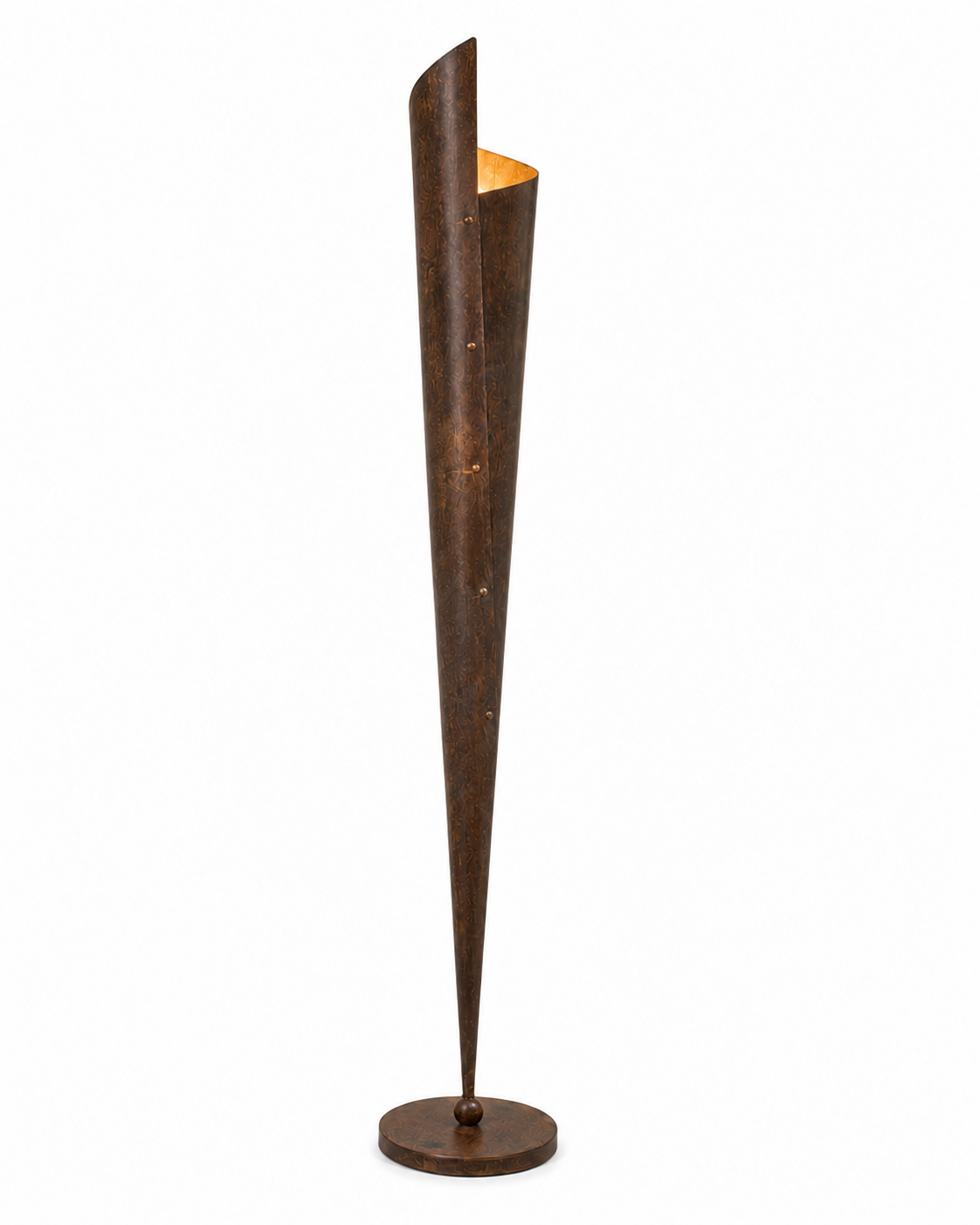 The Bonfire Floor Lamp by The Qratist features a handcrafted copper finished metal body with a sculptural tapered silhouette that emits a warm upward glow inspired by the timeless elegance of a bonfire.