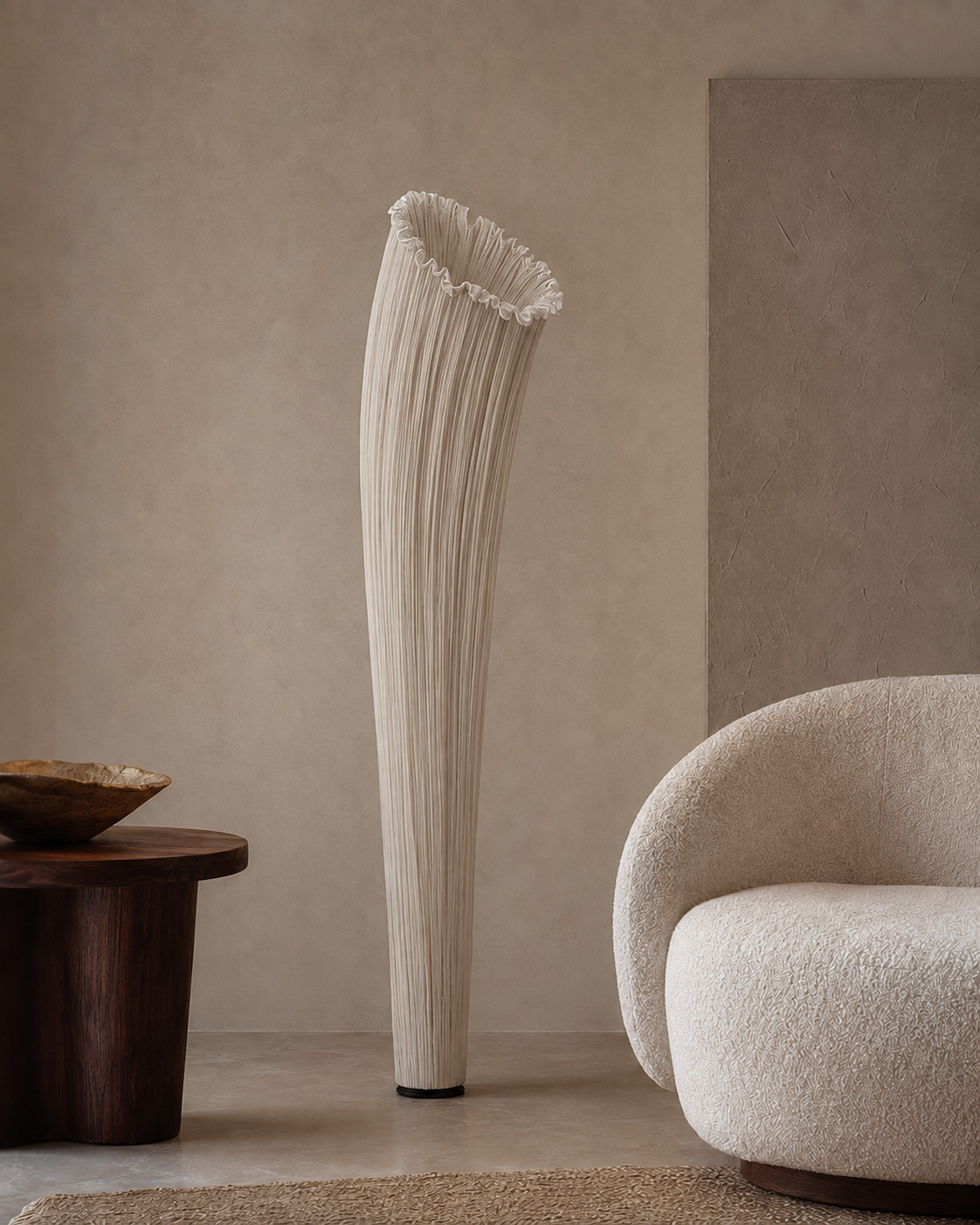 The Calla Lily Floor Lamp by The Qratist features a sculptural pleated cream white silk shade inspired by the elegant form of a blooming calla lily, creating a refined contemporary lighting statement.