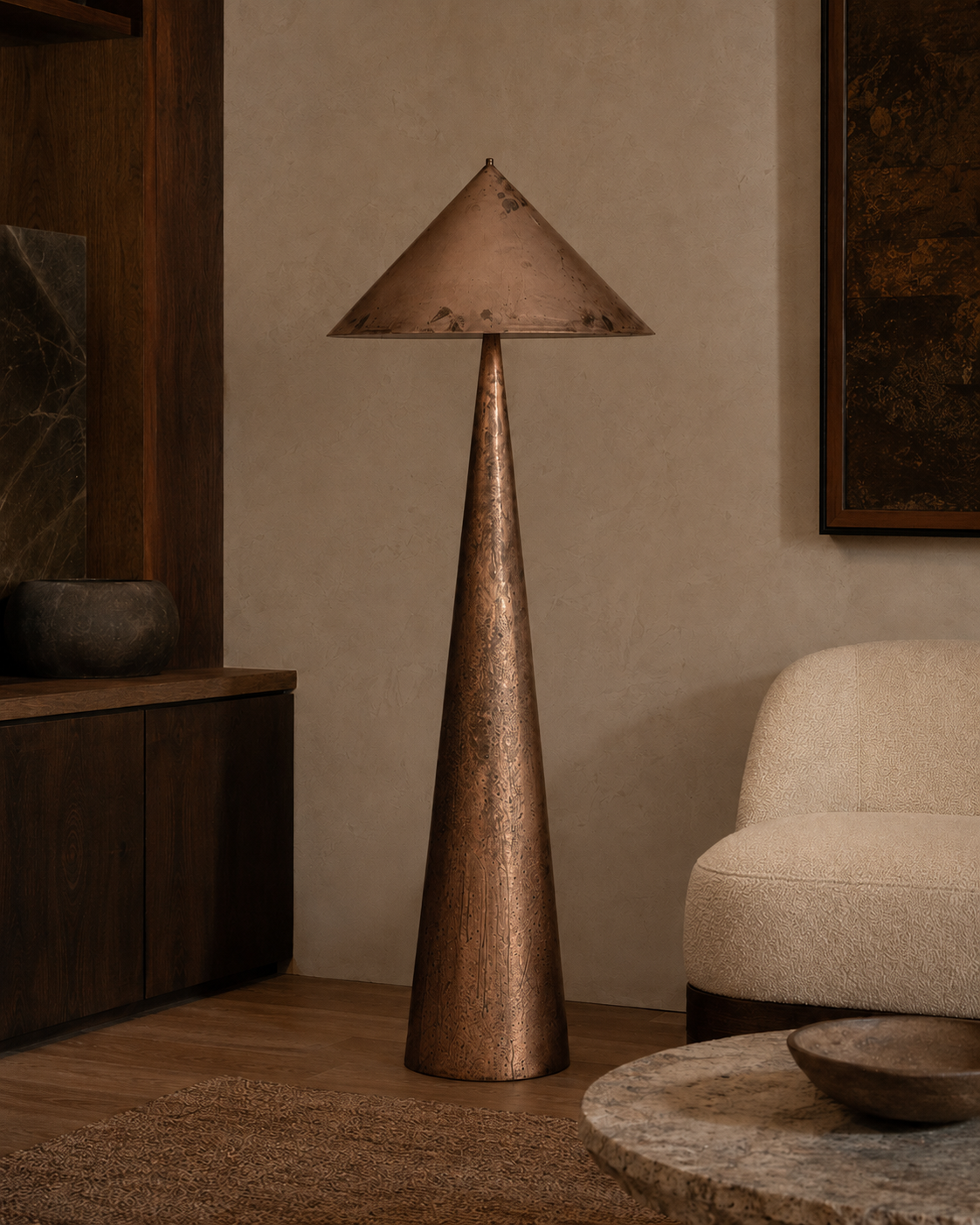 The Compass Floor Lamp by The Qratist features a handcrafted copper finished metal body with a sculptural geometric silhouette inspired by the timeless precision of a compass, creating a bold contemporary lighting statement.