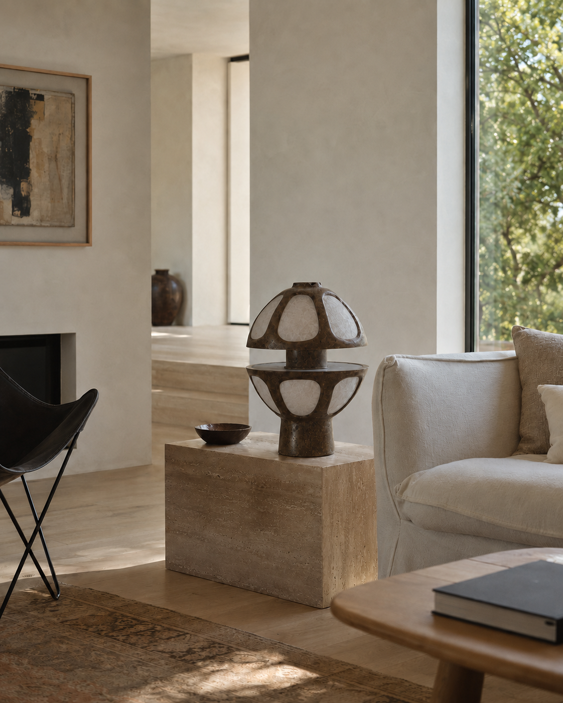 The Fungi Table Lamp by The Qratist features a sculptural mushroom inspired silhouette handcrafted from Unryu rice paper and metal, creating a warm ambient table lamp with soft natural illumination.
