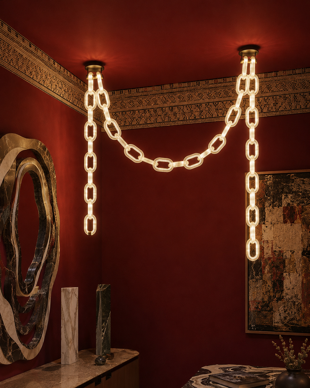 The Linked Chandelier by The Qratist features illuminated glass chain links suspended from a sleek metal frame, creating a bold contemporary architectural statement.