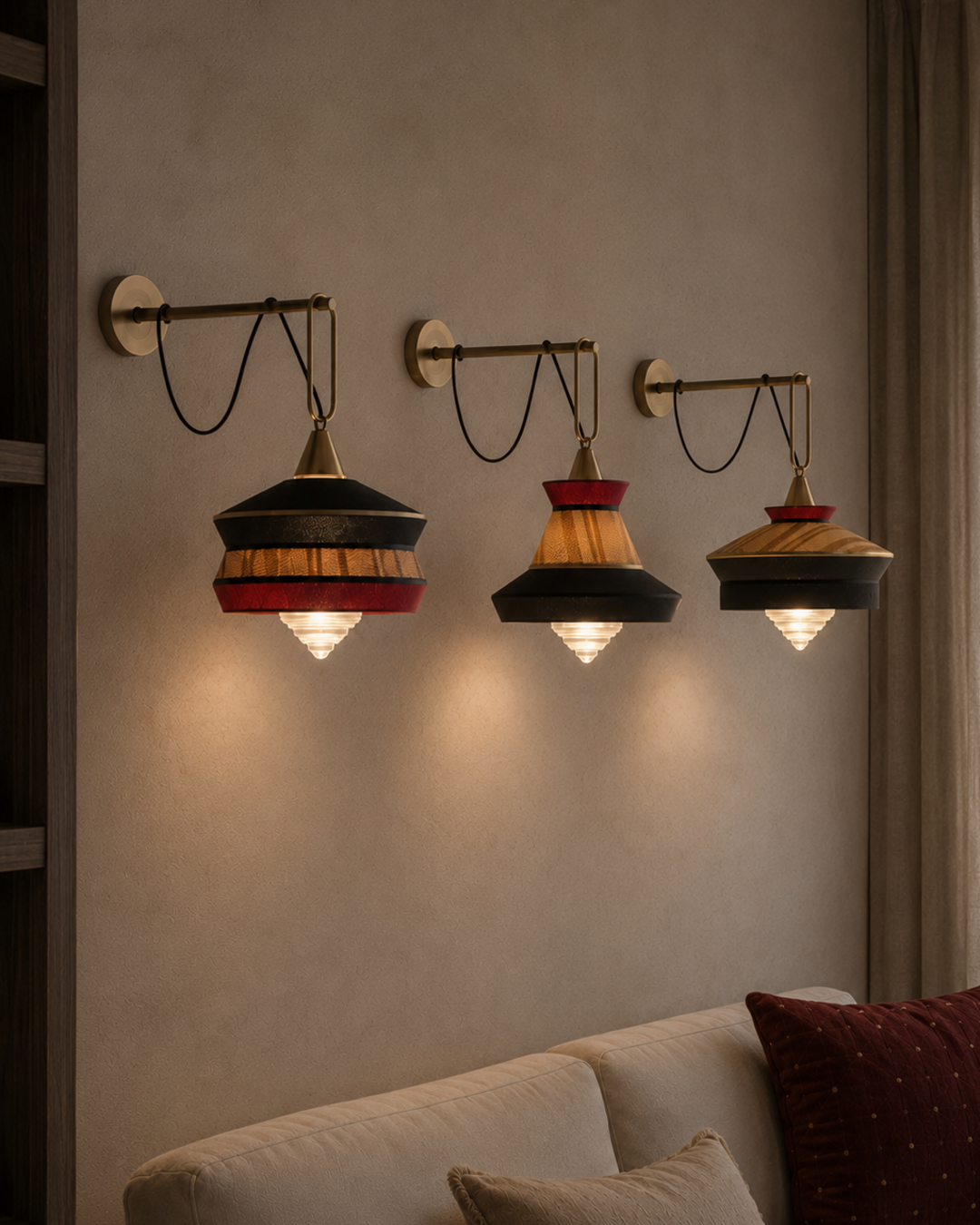 The London Wall Light by The Qratist features handcrafted metal, fabric, and glass in a lantern inspired design that creates warm ambient illumination.
