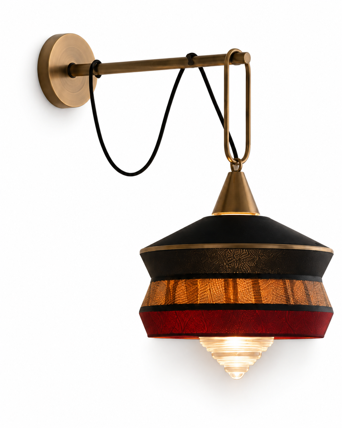 The London Wall Light by The Qratist features handcrafted metal, fabric, and glass in a lantern inspired design that creates warm ambient illumination.