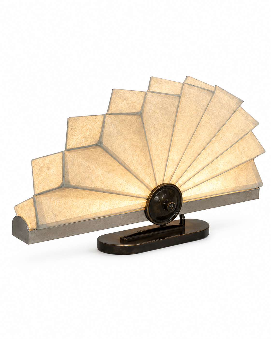 The Operatic Table Lamp by The Qratist features handcrafted paper panels arranged in an elegant fan inspired form with a refined metal frame, creating a sculptural table lamp with soft ambient illumination.