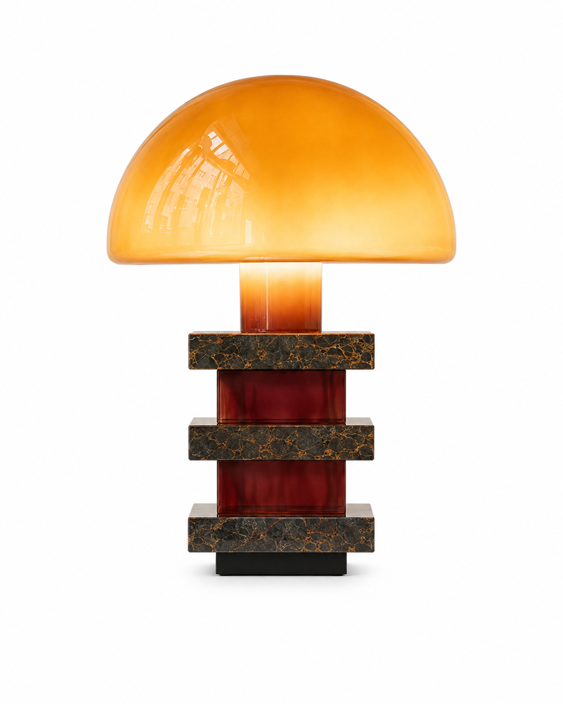 The Pagoda Table Lamp by The Qratist features a handcrafted amber blown glass dome balanced above sculptural glass columns and layered granite accents, creating a luxurious architectural statement table lamp.