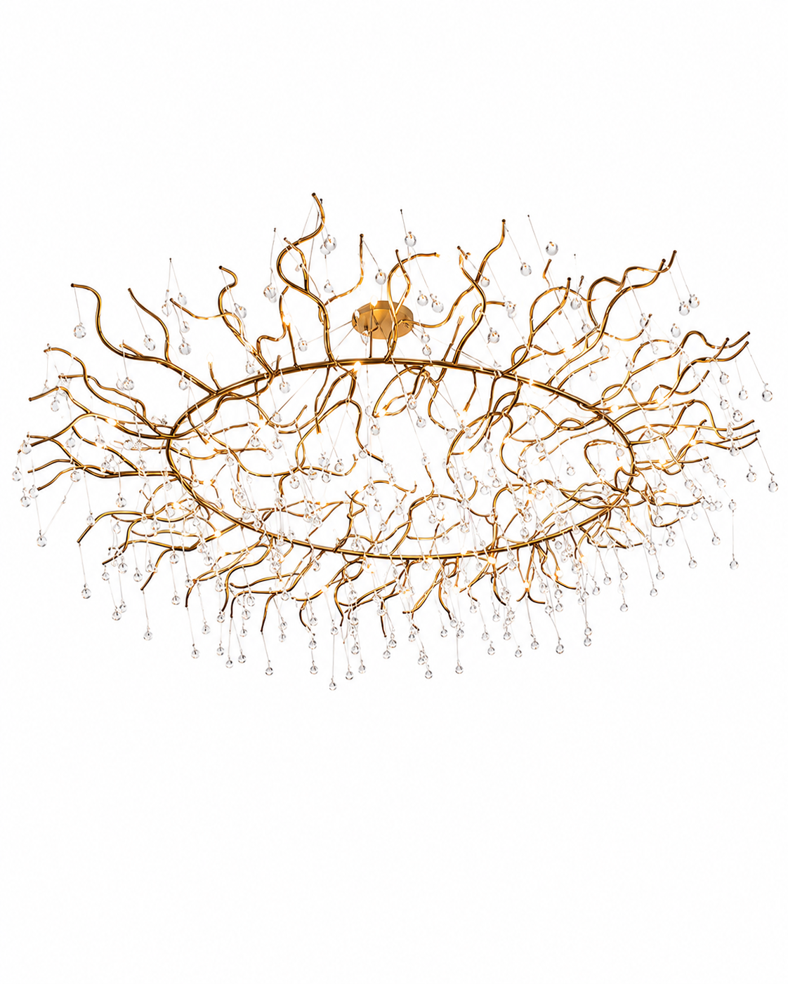 The Trendil Chandelier by The Qratist features handcrafted brass branches adorned with suspended glass droplets, creating a sculptural statement inspired by dew covered tree branches.