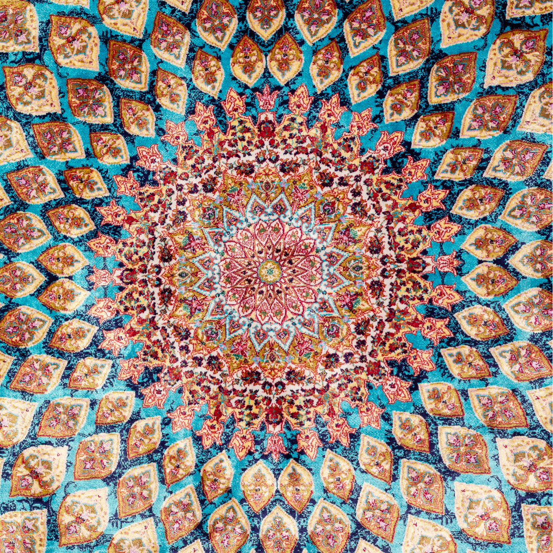 Verta silk rug featuring a turquoise blue base with intricate gold, ruby red, ivory, and fuchsia floral medallion design in a symmetrical pattern.