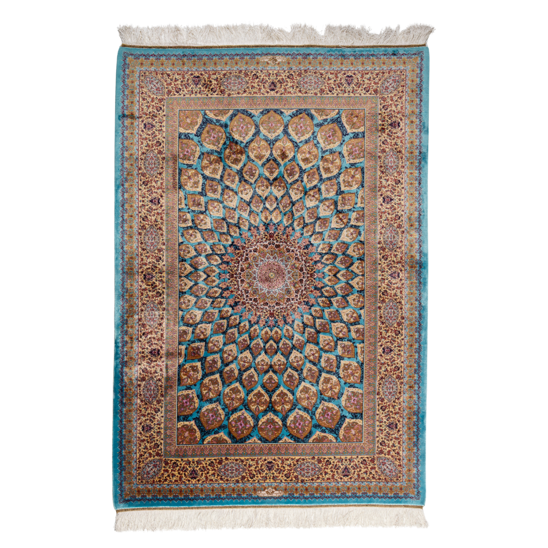 Verta silk rug featuring a turquoise blue base with intricate gold, ruby red, ivory, and fuchsia floral medallion design in a symmetrical pattern.