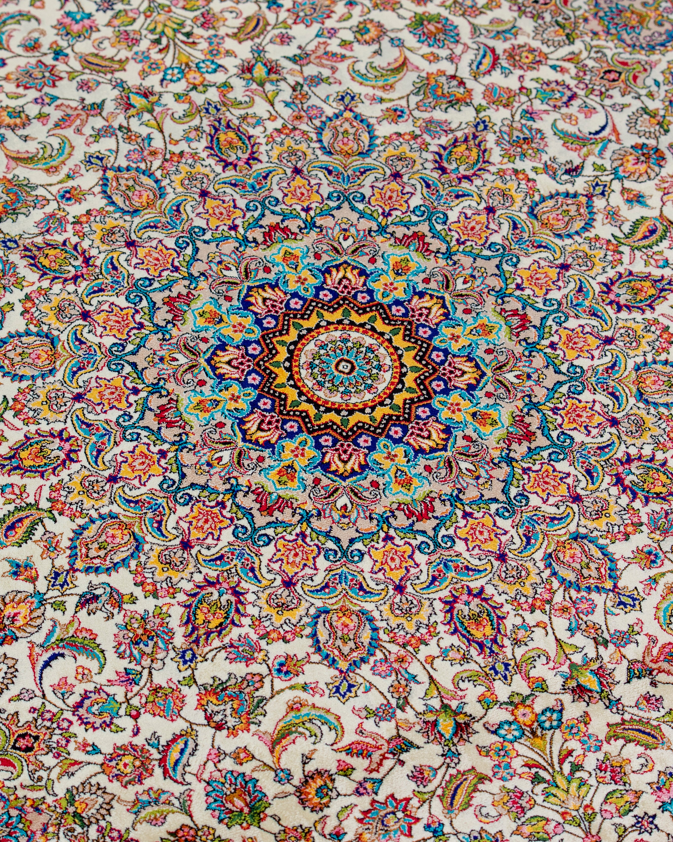 Central medallion and floral field detail of the Yasmin silk rug