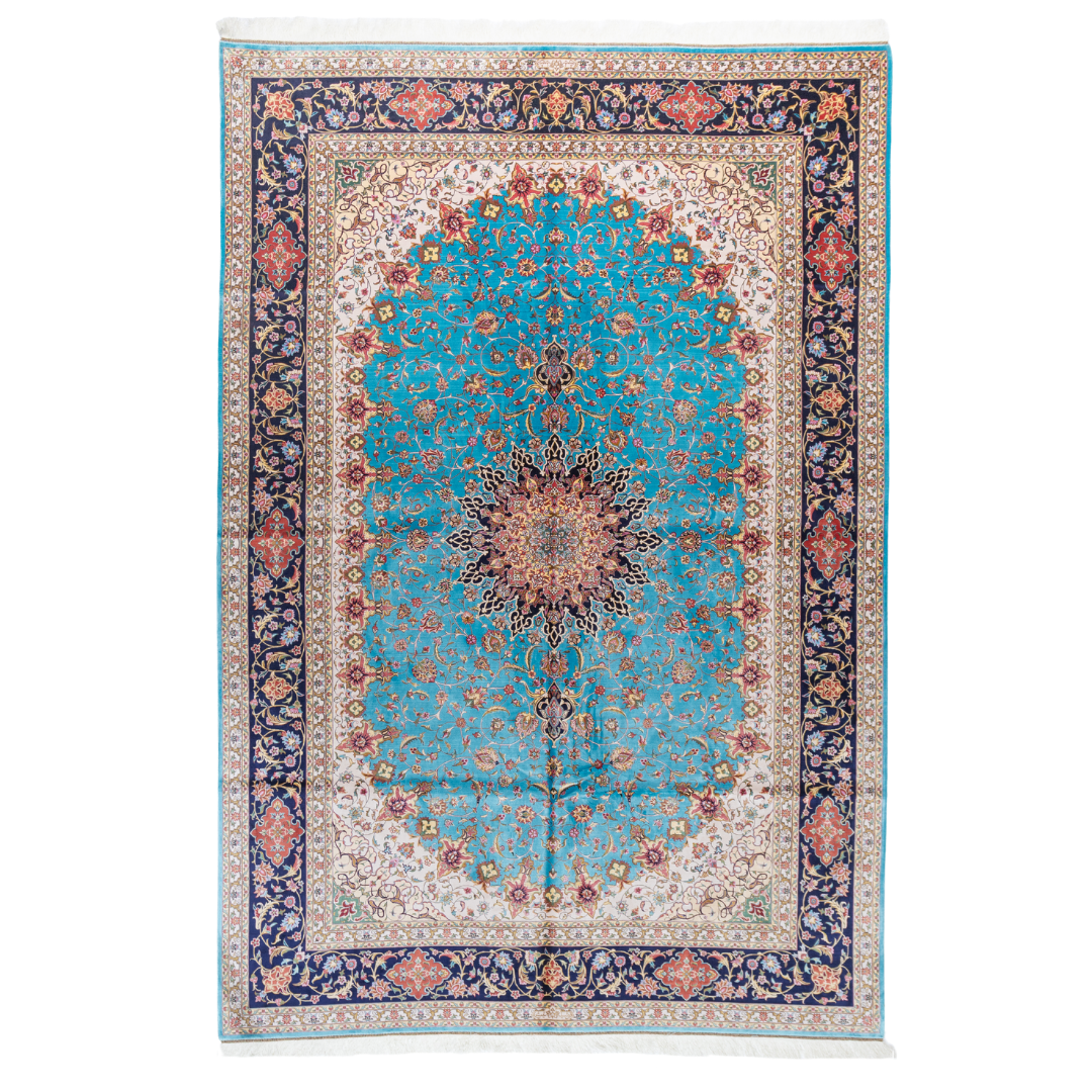 Intricately designed silk rug with turquoise base, floral patterns, and central medallion in red and gold – hand-finished and richly detailed.