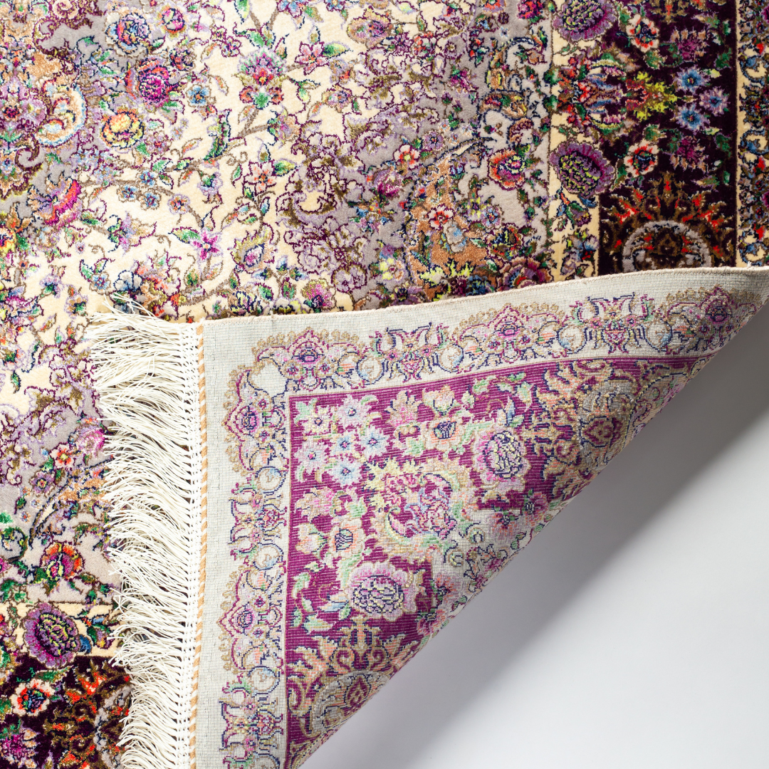 Zariah silk rug in ivory and purple with intricate floral design, handwoven with fine craftsmanship and premium detailing.
