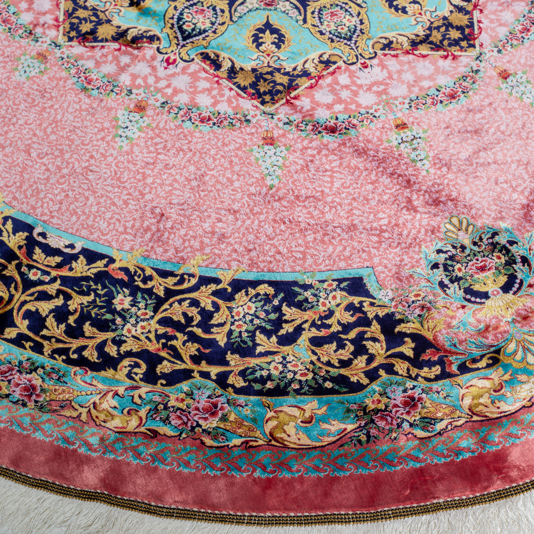 Round silk rug with a vibrant pink base, intricate navy floral borders, and detailed medallion center, 200x200 cm.