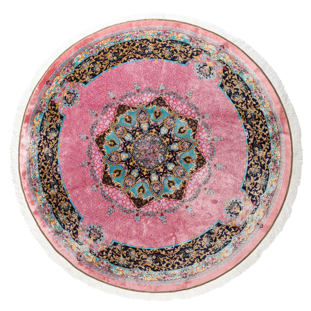 Round silk rug with a vibrant pink base, intricate navy floral borders, and detailed medallion center, 200x200 cm.