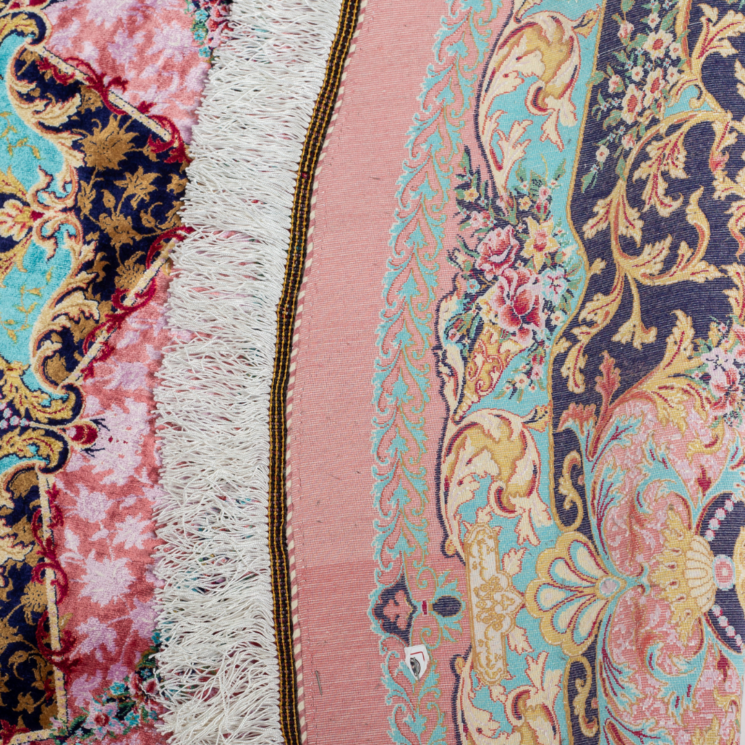 Round silk rug with a vibrant pink base, intricate navy floral borders, and detailed medallion center, 200x200 cm.