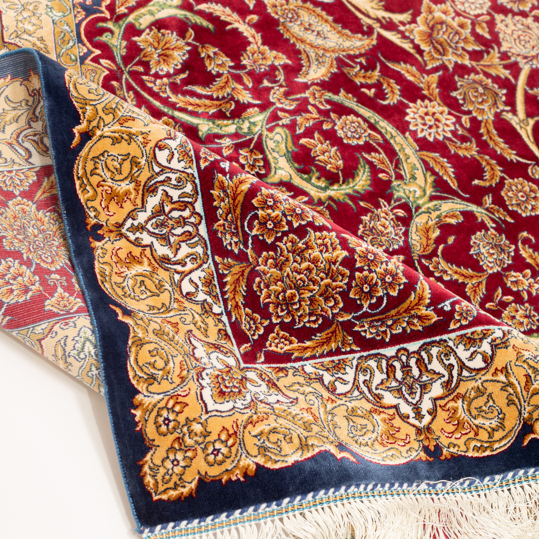 Zavira Silk Rug in 200x300 cm with crimson red base, ornate golden floral patterns, navy accents, and intricate woven detailing.