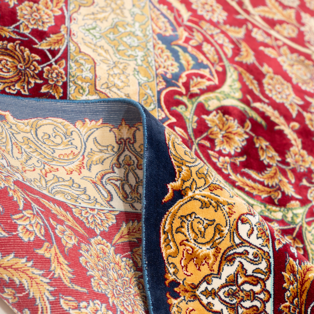 Zavira Silk Rug in 200x300 cm with crimson red base, ornate golden floral patterns, navy accents, and intricate woven detailing.