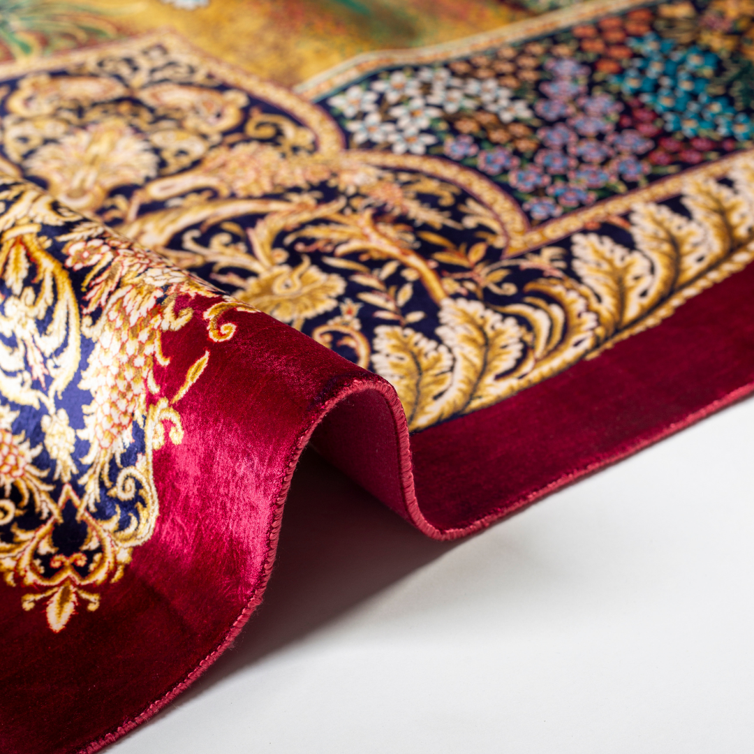 Silk rug with tree of life and bird motif, burgundy floral base, and ornate navy-gold borders. Handwoven with artistic precision.