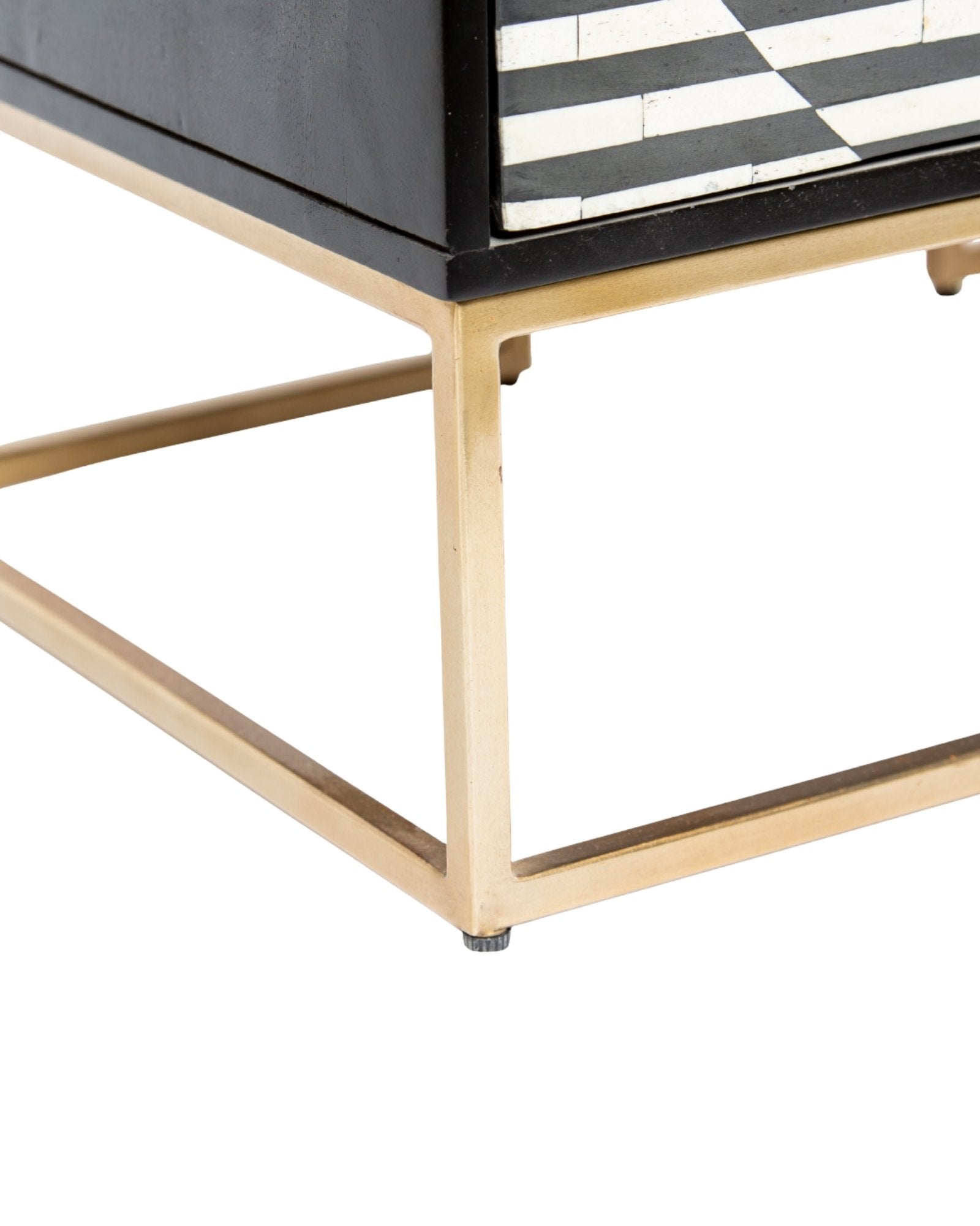 Black and white geometric bone inlay chest of drawers with gold base.