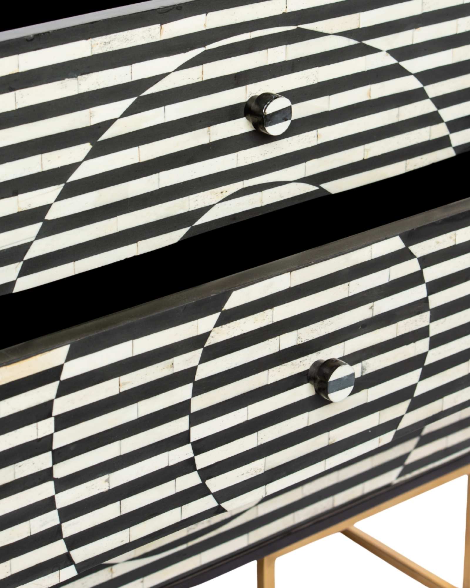 Black and white geometric bone inlay chest of drawers with gold base.