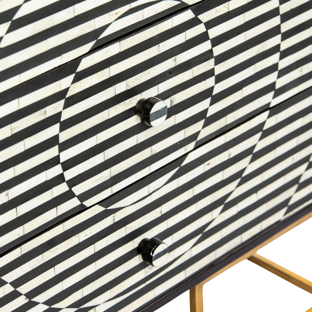 Black and white geometric bone inlay chest of drawers with gold base