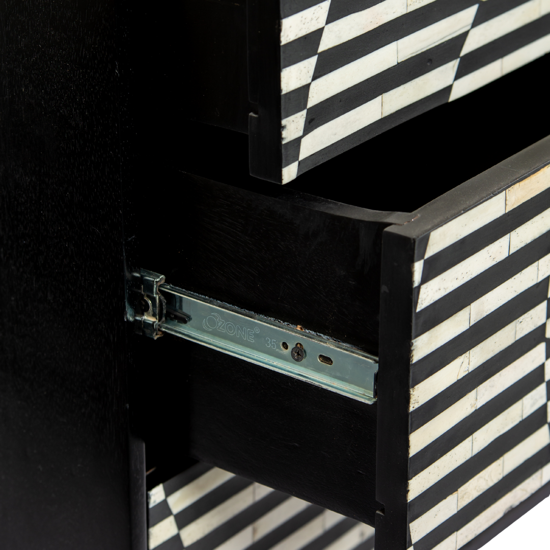 Black and white geometric bone inlay chest of drawers with gold base