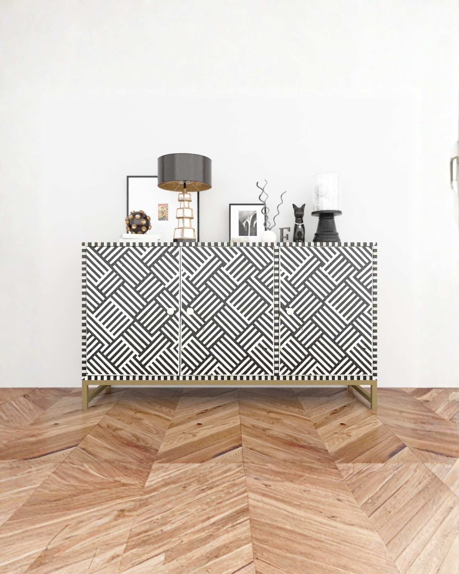 Handcrafted black & white cabinet with intricate bone inlay, featuring a striped pattern and sleek metal legs. A luxurious storage solution for any space. 
