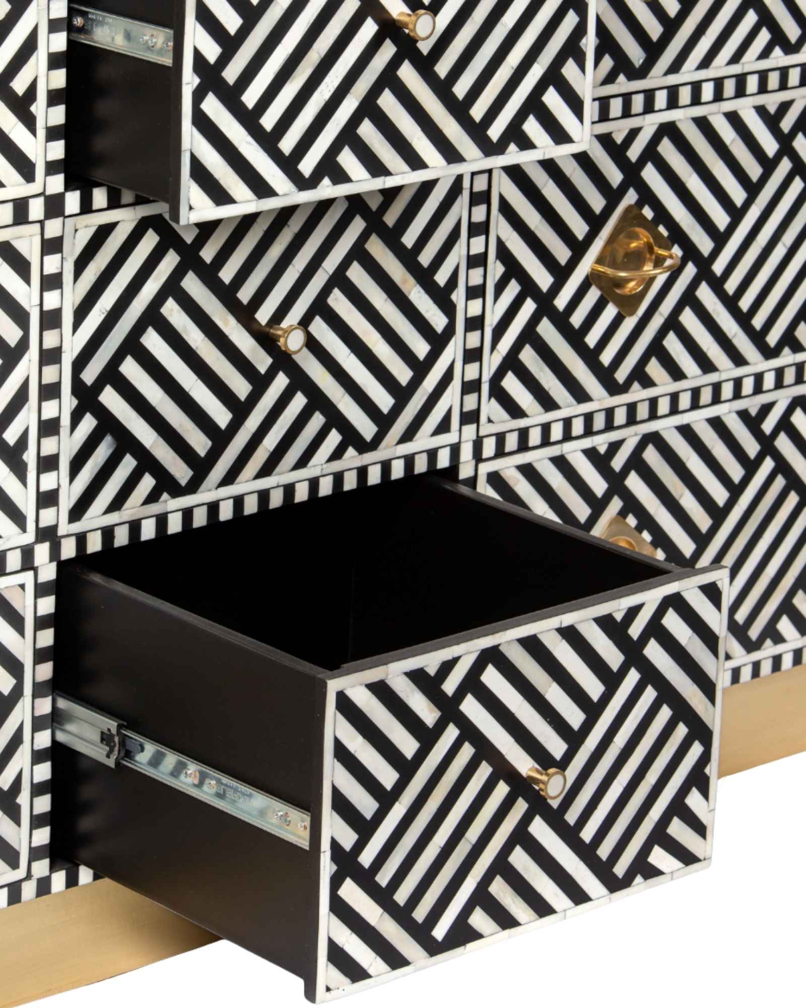Luxury black and white bone inlay chest of drawers with brass accents and geometric design, handcrafted for statement interiors.