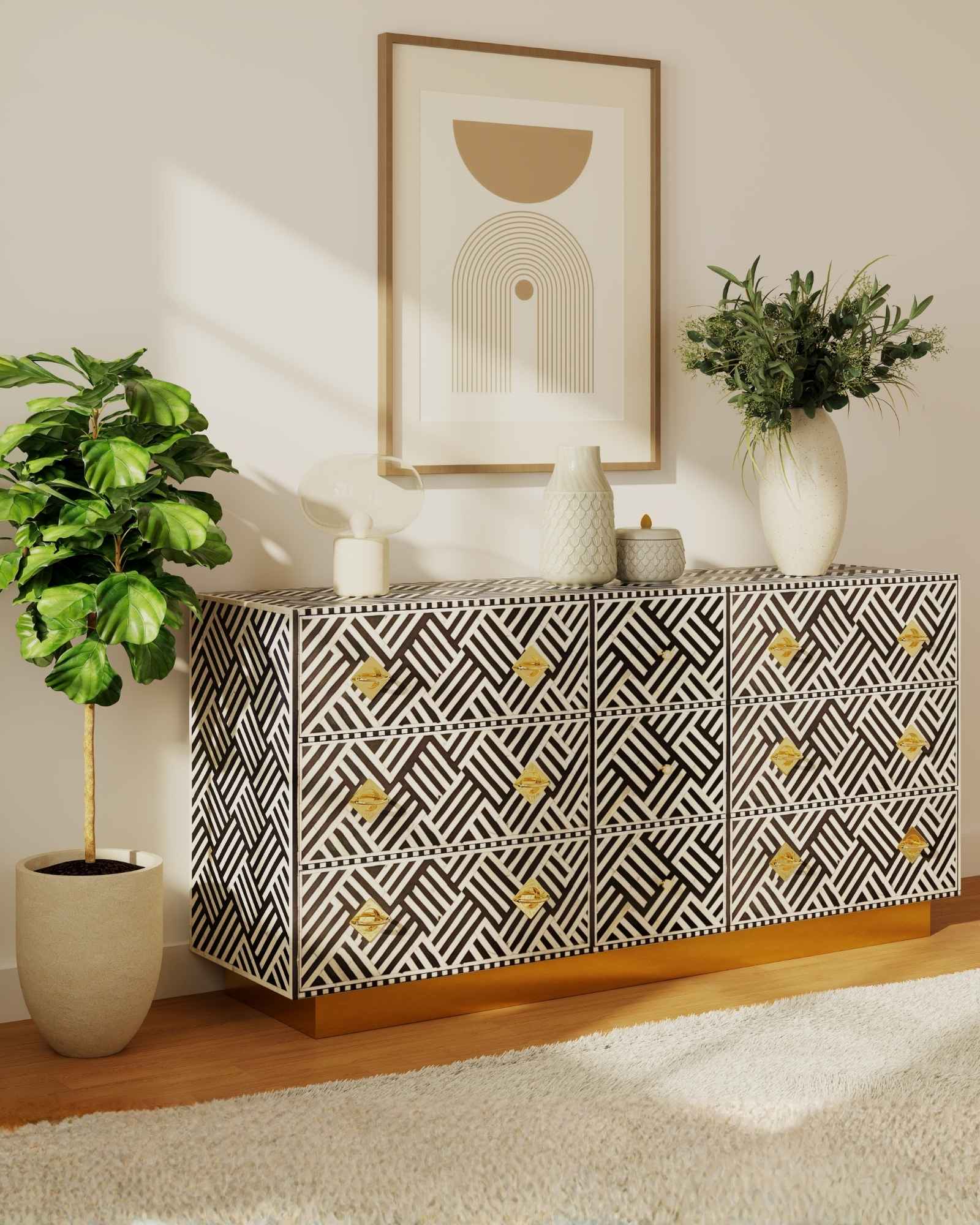Luxury black and white bone inlay chest of drawers with brass accents and geometric design, handcrafted for statement interiors.