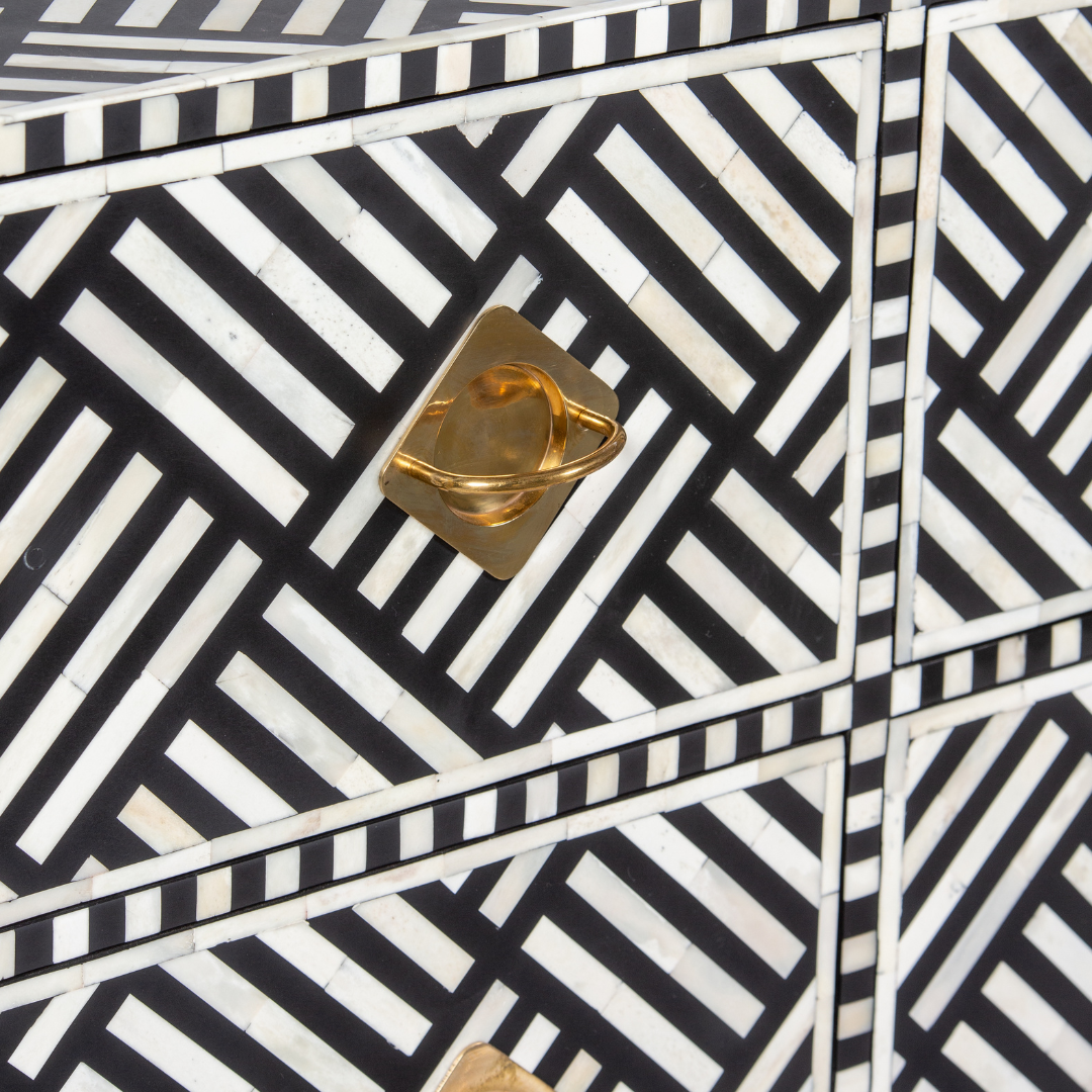 Luxury black and white bone inlay chest of drawers with brass accents and geometric design, handcrafted for statement interiors.