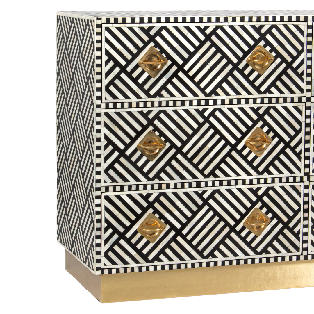 Luxury black and white bone inlay chest of drawers with brass accents and geometric design, handcrafted for statement interiors.
