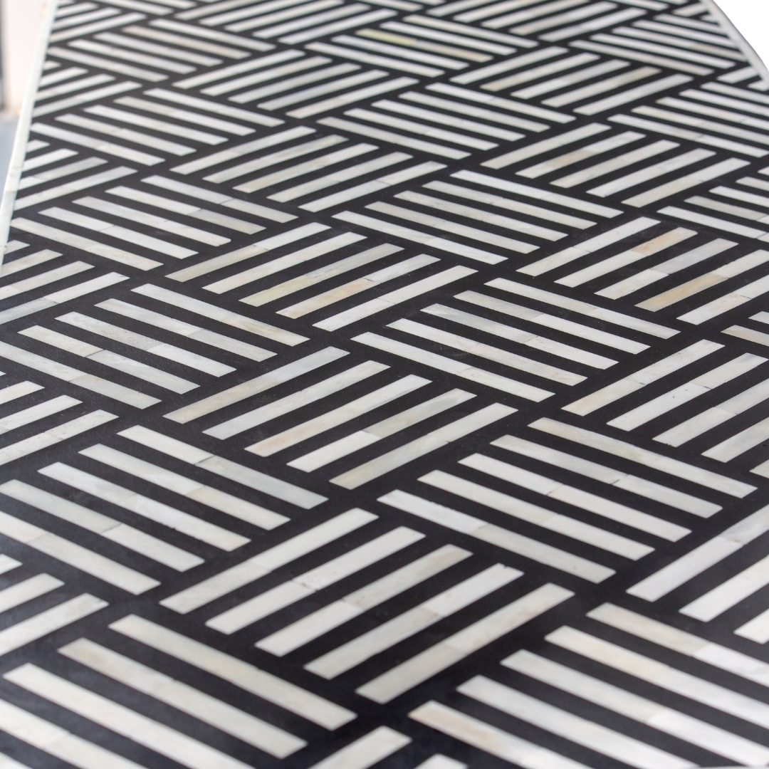 Luxury black and white bone inlay chest of drawers with brass accents and geometric design, handcrafted for statement interiors.