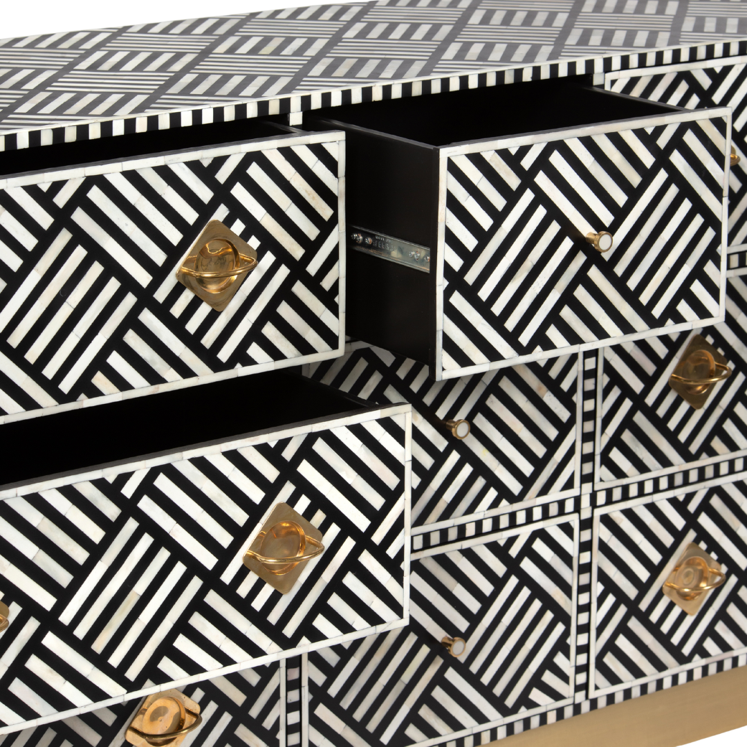 Luxury black and white bone inlay chest of drawers with brass accents and geometric design, handcrafted for statement interiors.